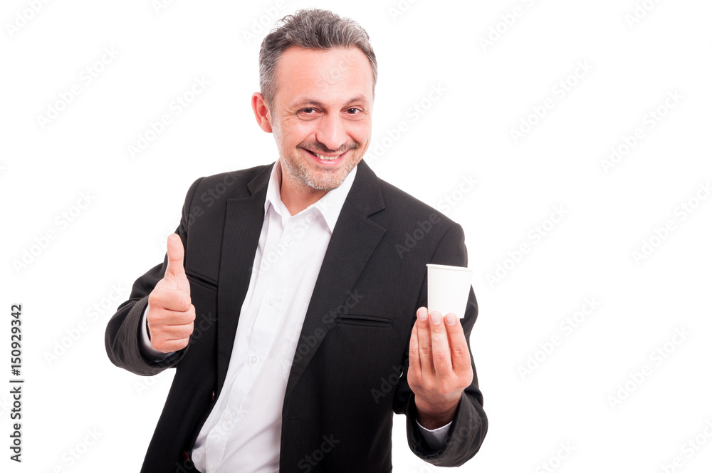 Young handsome man smiling and showing thumb up Young handsome man smiling and showing thumb up