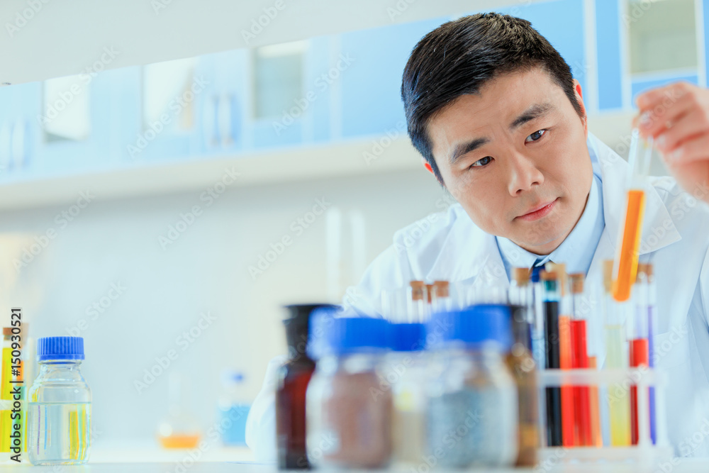 young asian doctor in uniform working at testing laboratory, chemical laboratory young asian doctor in uniform working at testing laboratory, chemical laboratory