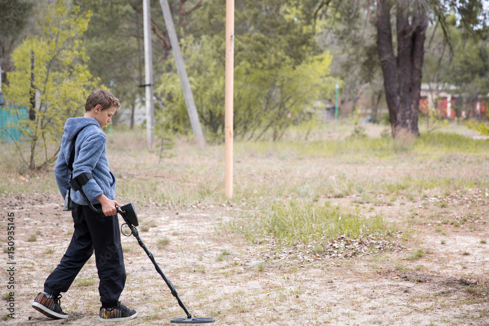 boy with a metal detector