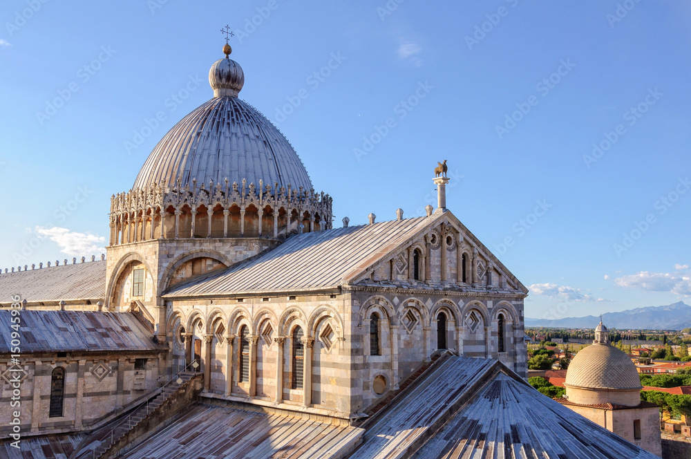 The dome with the Greek cross and the bronze hippogriff on the roof of the Duomo - Pisa, Tuscany, Italy