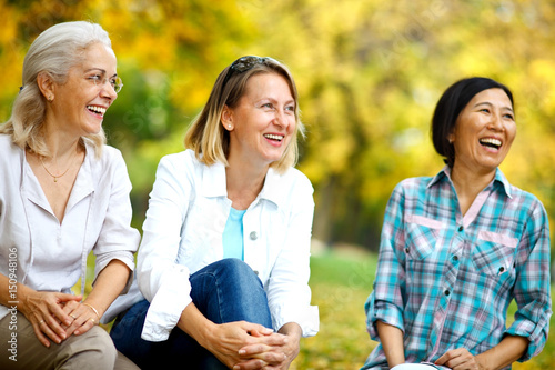 Three mature ladies smiling photo