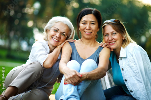 Three mature ladies smiling