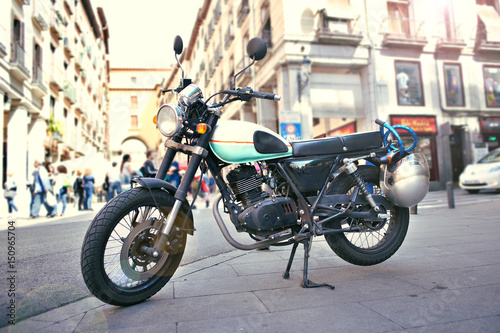 Classic retro motorcycle on street in city