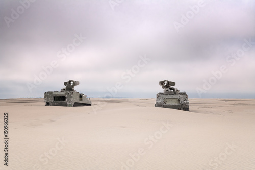 Militairy tanks destructed on beach