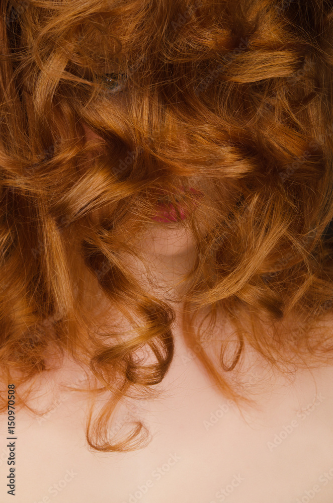 Naklejka premium Beautiful long red hair on the face of woman