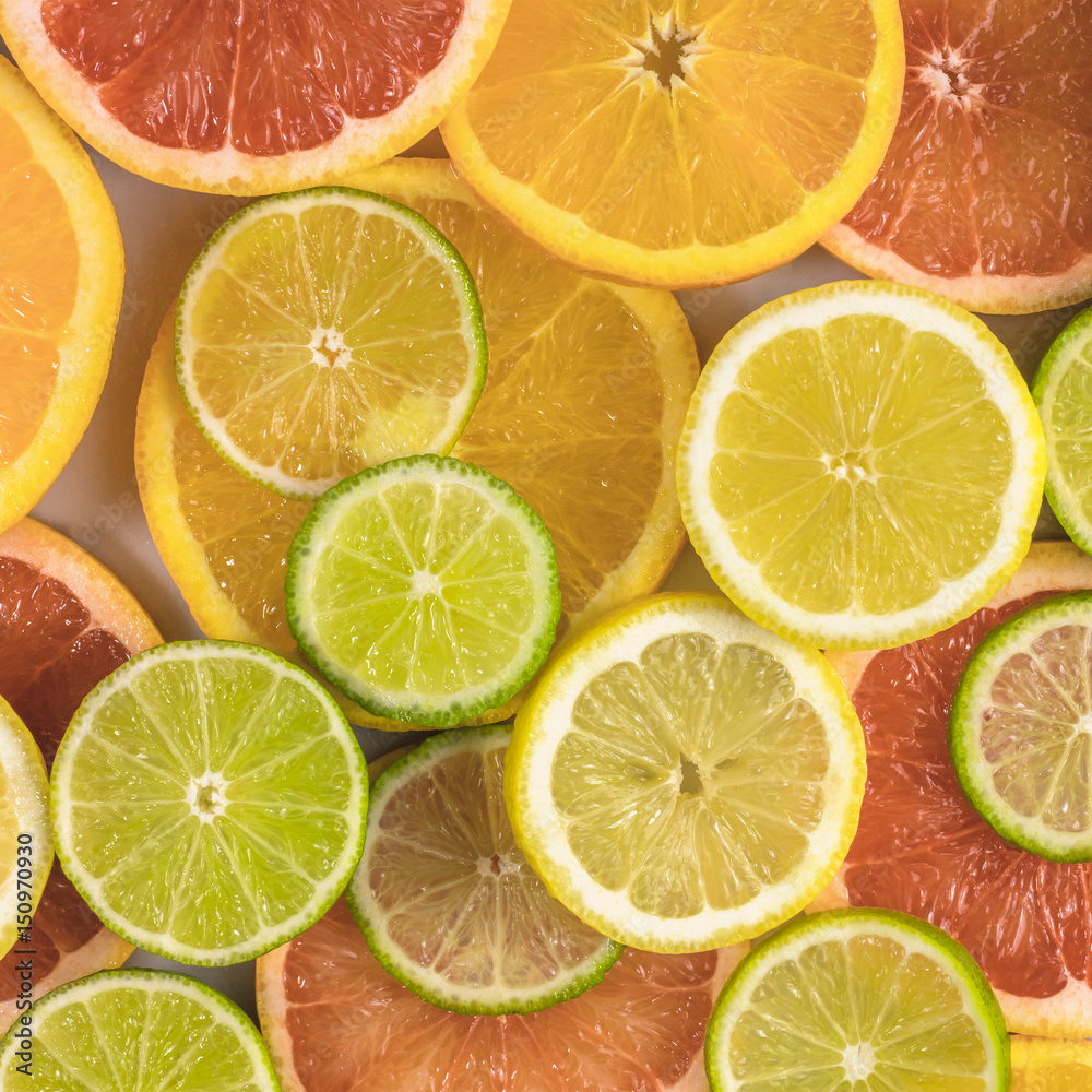 Grapefruit, lime, lemon, and orange slices background Grapefruit, lime, lemon, and orange slices background