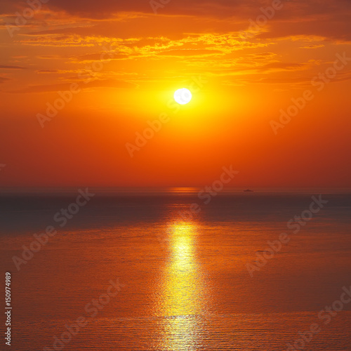 Fototapeta Naklejka Na Ścianę i Meble -  Panoramic dramatic sunset sky over sea at dusk