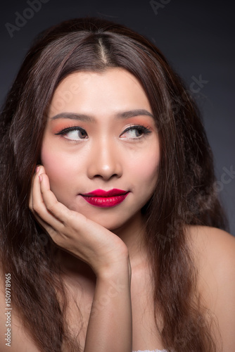 Beautiful asian woman face with perfect makeup.