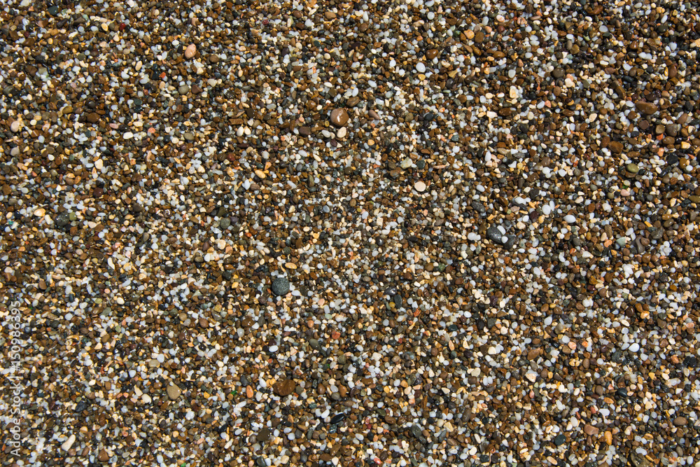Background with different color sea stones. Pebbles as a background image. Background with different color sea stones. Pebbles as a background image.