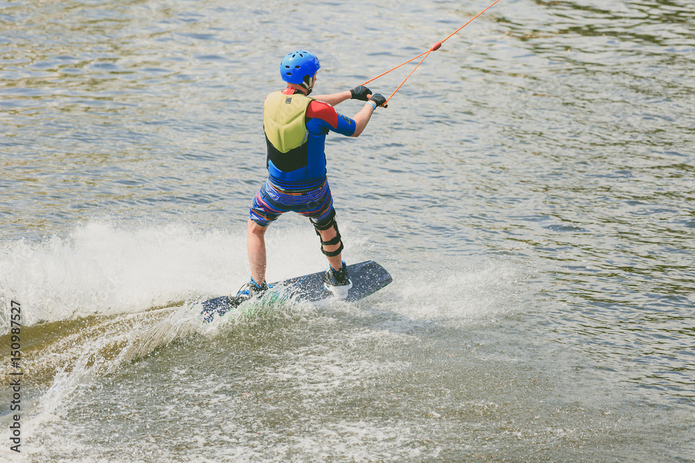 a young man practiced jumping at Wakeboarding. Photo processing grain. a young man practiced jumping at Wakeboarding. Photo processing grain.