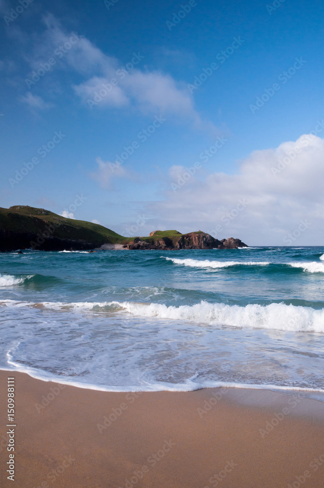 Waves from the Atlantic Ocean crashing at a beach on the Isle of Lewis in Scotland.