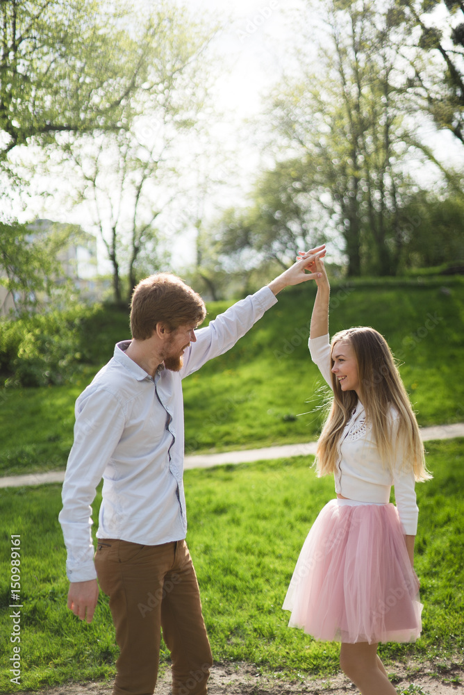 Fototapeta premium Young man and woman love romance summer longboard skateboard pink skirt tutu sneakers