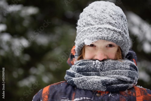 Boy in the winter forest