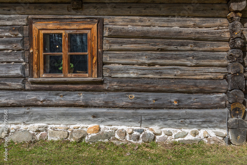 Facade Of Old Wooden House With Window