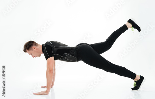 Attractive strong sportsman make sports exercises