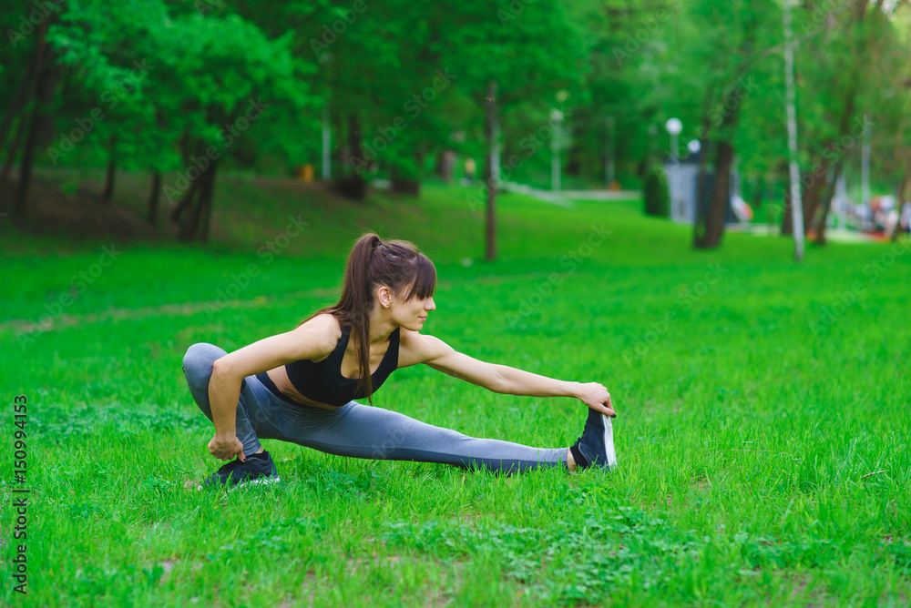 Girl in the park doing exercises
