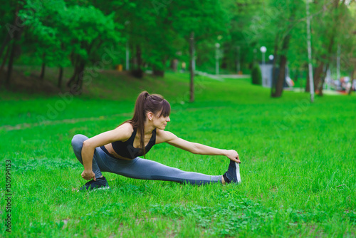 Girl in the park doing exercises