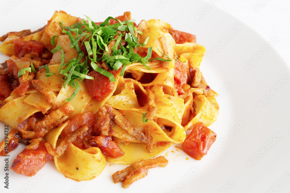 pasta with bacon, tomato, and onion decorated with parsley pasta with bacon, tomato, and onion decorated with parsley