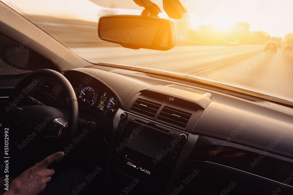 Drive car at high speed at sunset