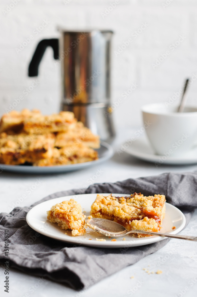Apricot jam streusel cake bar on plate Apricot jam streusel cake bar on plate