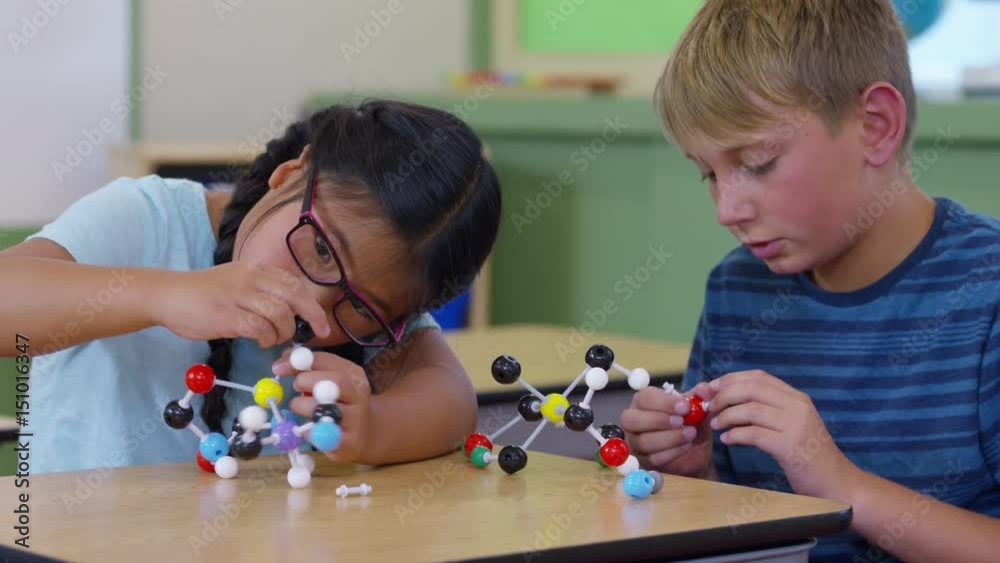 Students in school classroom build science models