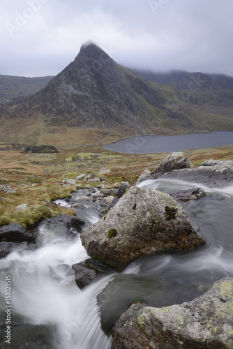 Water cascading down a fall on the Afon Lloer, overlooking the Ogwen Valley and Tryfan in the Glyderau mountain range, Snowdonia, Wales photo
