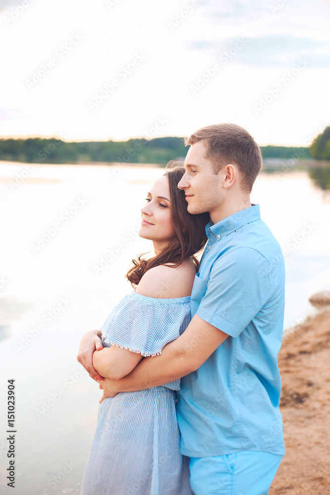 happy romantic couple in love and having fun at the lake outdoor in summer day, beauty of nature, harmony concept