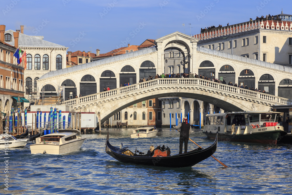 Gondola on Grand Canal and Rialto Bridge in winter, Venice, Veneto Gondola on Grand Canal and Rialto Bridge in winter, Venice, Veneto
