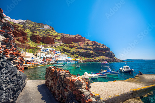 The old harbor of Ammoudi under the famous village of Ia at Santorini, Greece. photo