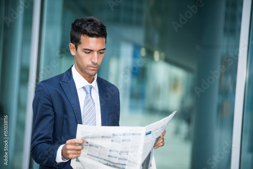Businessman reading a newspaper