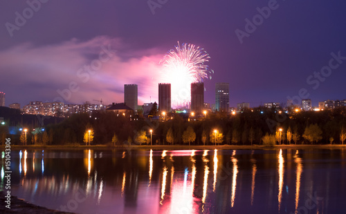 Fireworks over the lake, the city's night skyline,