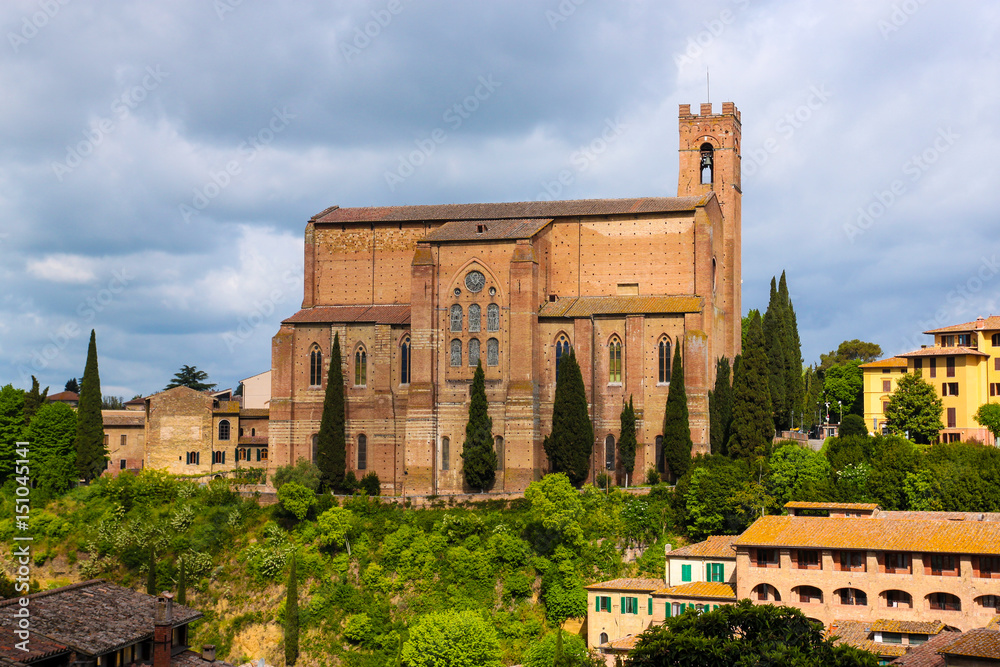 Aerial view of Siena and Basilica of San Domenico (Basilica Cateriniana) is basilica church in Siena, Tuscany, Italy