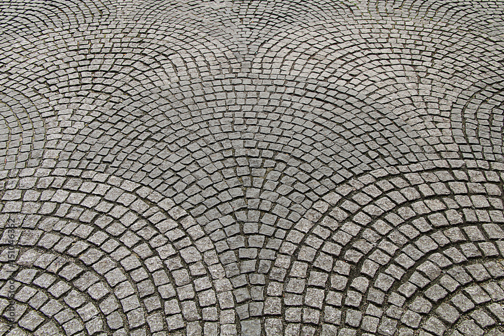 Texture of the paving stone in the form of cubes lined with circles
