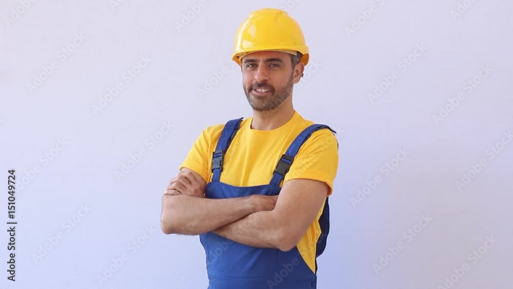 Nice-looking handyman smiling at the camera Nice-looking handyman smiling at the camera