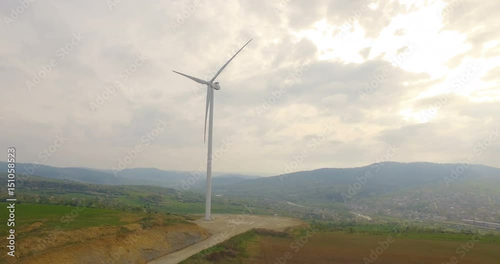 Aerial drone view on Wind Turbine, Windmill, Energy Production in mountains Aerial drone view on Wind Turbine, Windmill, Energy Production in mountains