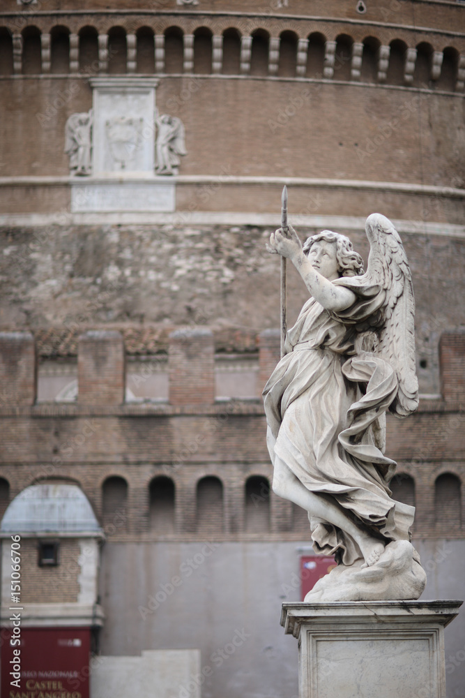 Angel with a spear statue on the Ponte Sant Angelo bridge in Rome, Italy