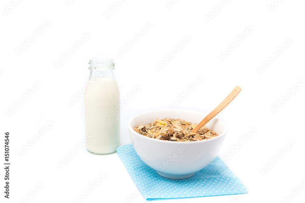 Delicious and healthy cereal in bowl with milk. Morning breakfast isolated on white background