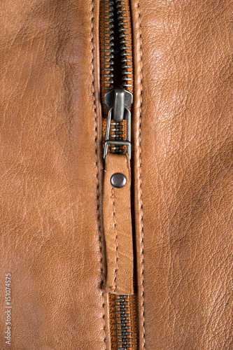 Light brown leather jacket zippers and pockets. Macro leather jacket details