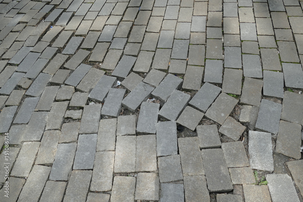 broken pattern of street cobble pavement