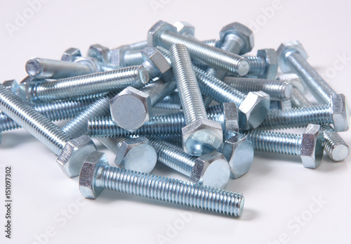 metal bolts on white background