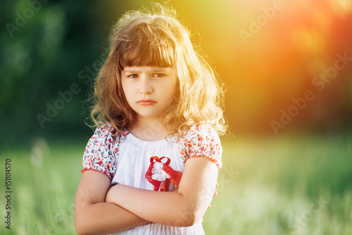 A little offended girl crossed her arms.