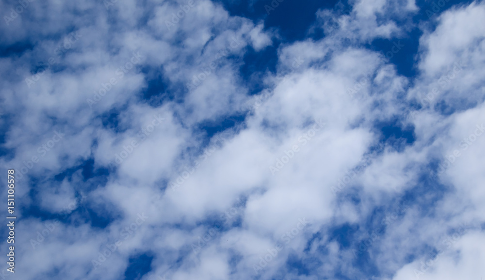 White clouds in deep blue sky