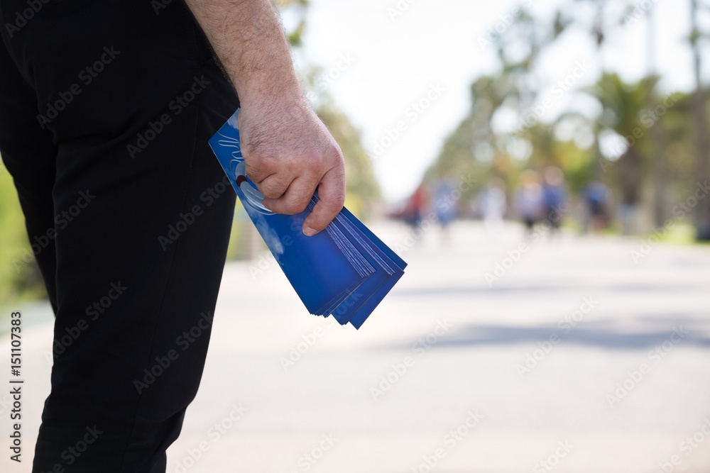 Fototapeta premium Man Waiting to Give Out Gospel Tracts