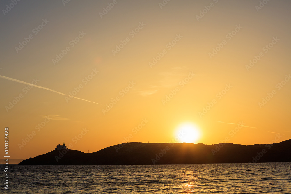 Greece, Kea island. Lighthouse at sunset