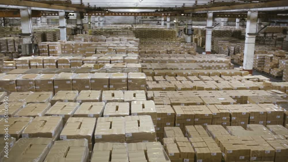 Factory warehouse with stacks of boxes Factory warehouse with stacks of boxes