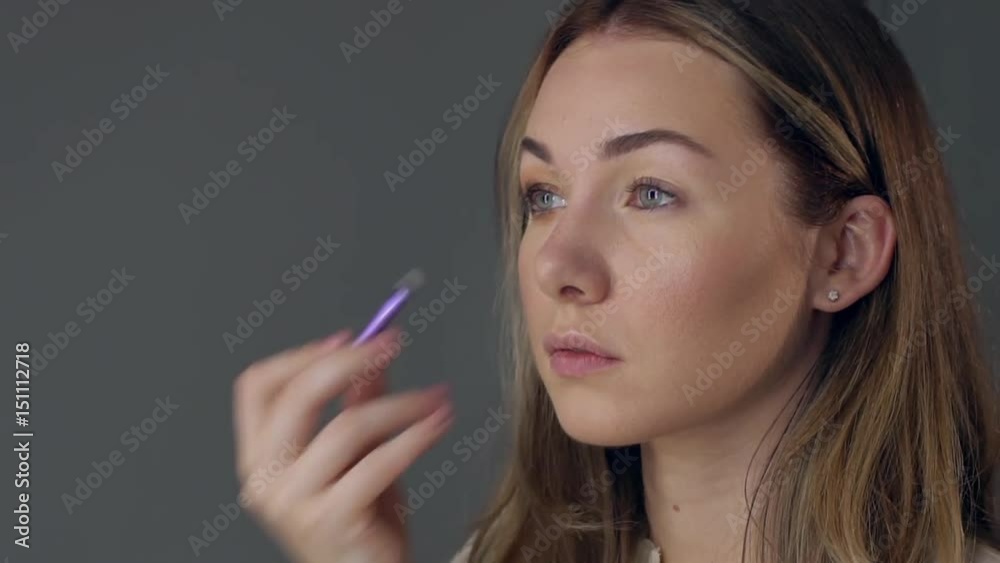 Make-up artist applying eye shadow with brush, close up. Make-up artist applying eye shadow with brush, close up.
