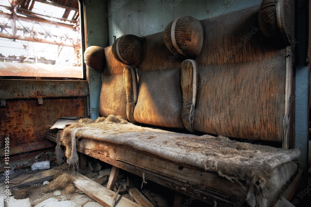 Damaged retro seats in a cabin