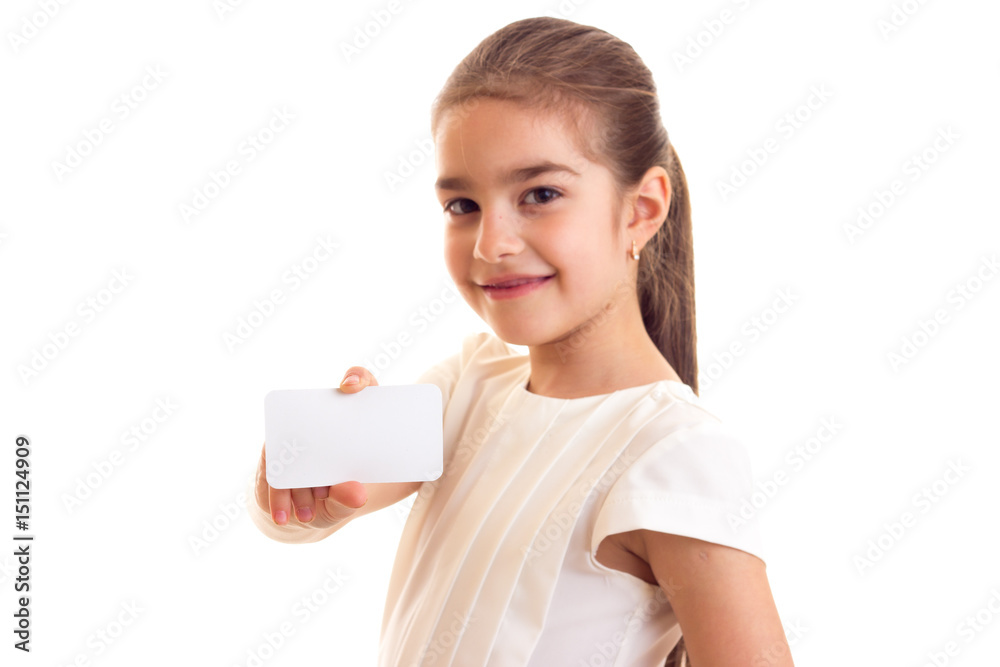 Little girl in white T-shirt holding white card Little girl in white T-shirt holding white card
