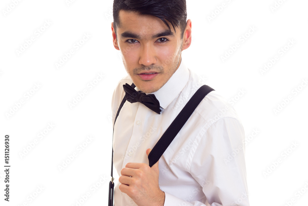 Young man with bow-tie and suspenders Young man with bow-tie and suspenders