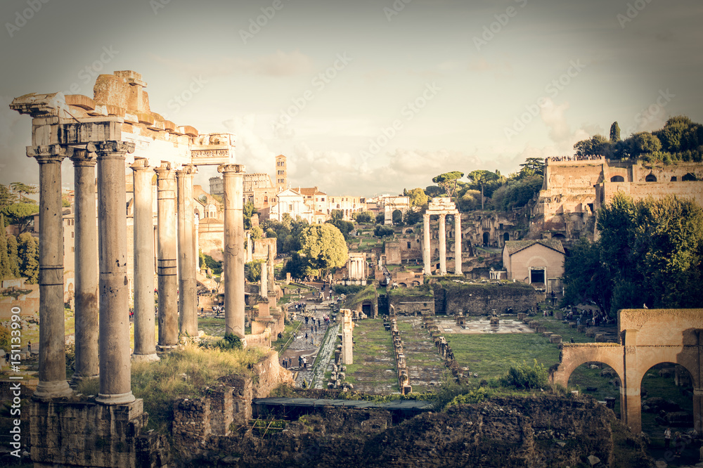 Roman ruins in Rome, Forum. Ancient ruins of the Romanum Forum. Ruins of Septimius Severus Arch and Saturn Temple, Rome, Italy.